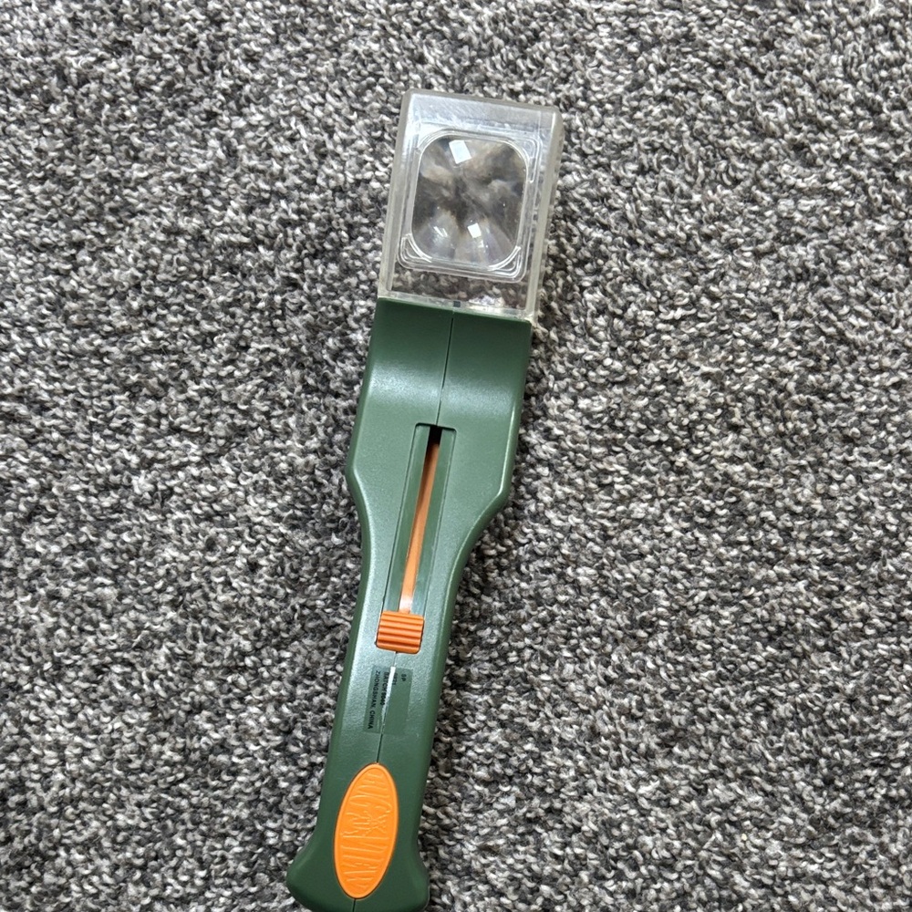 Green and Orange Magnifying Tool for outside bugs